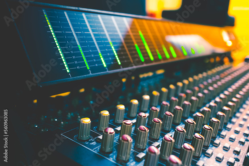 Foto VU meter on audio mixing console meter bridge and knobs