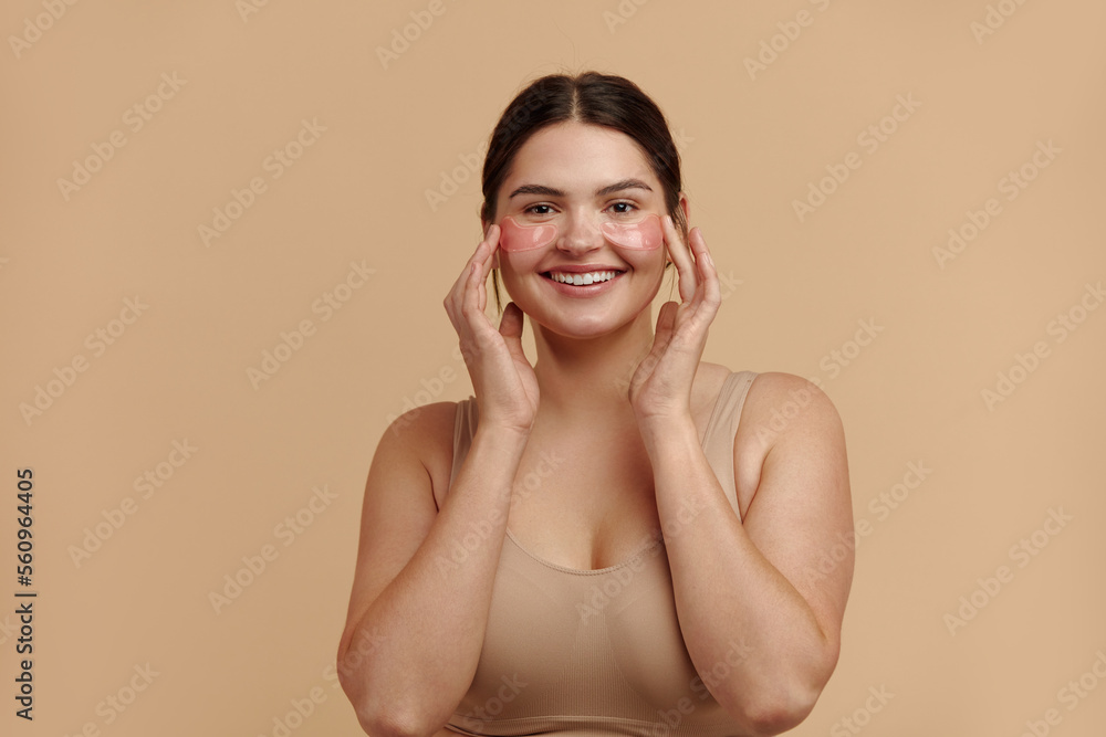 Obraz premium Under Eye Patches. Closeup Of Plus Size Woman With Natural Makeup And Healthy Fresh Skin Posing With Collagen Hydrogel Eye Patches Under Eyes. High Resolution