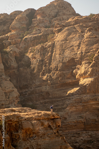 sitting on the edge of the canyn, petra trail, jordan photo