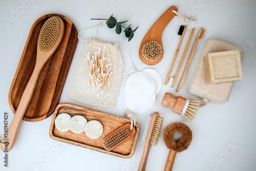 Set of wooden eco friendly devices. Brushes, washcloth and ear sticks, natural soap on a white background. Flat lay
