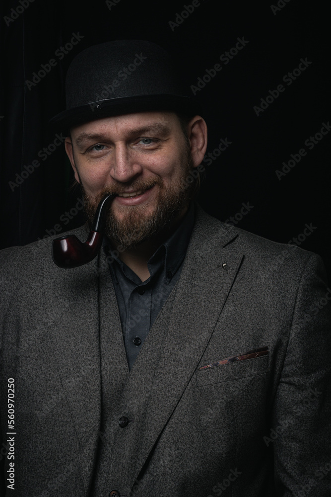stylish man in retro outfit suit hat smoking wooden pipe sherlock holmes look cosplay england gentleman fashionable confident gangster Guy Ritchie Charlie Hunnam style