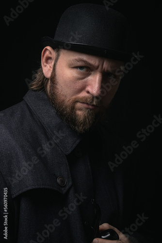 stylish man in retro outfit suit hat smoking wooden pipe sherlock holmes look cosplay england gentleman fashionable confident gangster Guy Ritchie Charlie Hunnam style photo