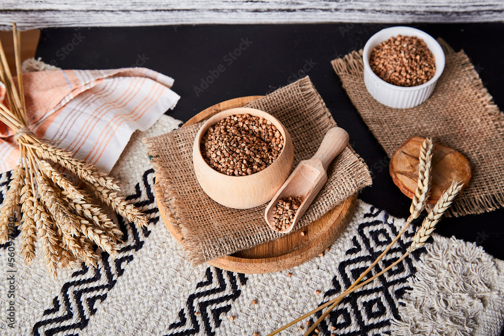Aesthetic superfood - buckwheat porridge. Healthy breakfast with cutlery made of natural cotton and wood. Natural background. Aesthetic superfood - buckwheat porridge. Healthy breakfast with cutlery made of natural cotton and wood. Natural background.