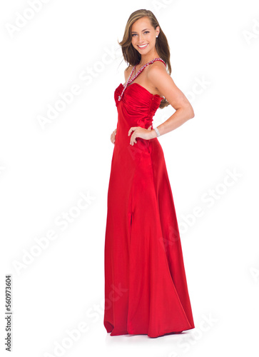 Elegant, prom and portrait of a woman in a red dress for an event isolated on a white background in a studio. Happy, fashion and model in a silk ball gown for a celebration on a studio background © T. Rose/peopleimages.com