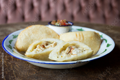 Venezuelan empanadas are made from precooked white or yellow cornmeal.