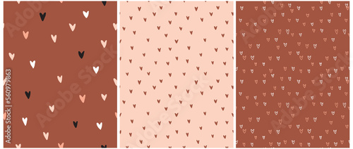Romantic Seamless Vector Patterns with Tiny Hand Drawn Hearts Isolated on a Coral Pink and Brown Background. Simple Doodle Irregular Print with Freehand Hearts ideal for Fabric, Wrapping Paper.
