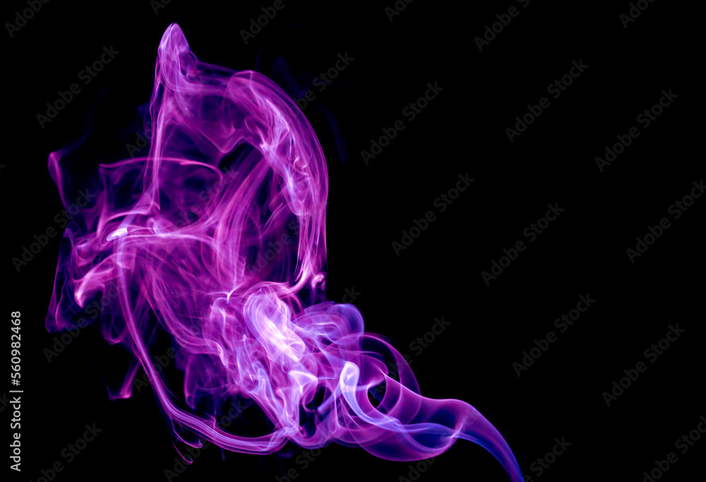 Colored abstract smoke on a black background. Figures made of smoke. Colored abstract smoke on a black background. Figures made of smoke.