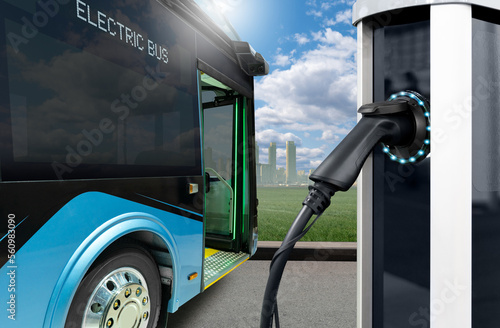 Leinwand Poster Electric city bus with charging station on a background of cityscape