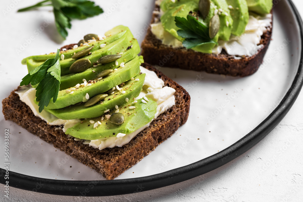 Avocado toast with goat cheese, seeds Avocado toast with goat cheese, seeds