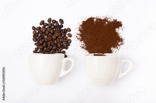 Ground coffee and beans in coffee cups in bulk isolated on a white background.