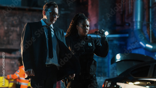 Fotografie Detective Arriving at Crime Scene at Night and Greeted by a Black Policewoman
