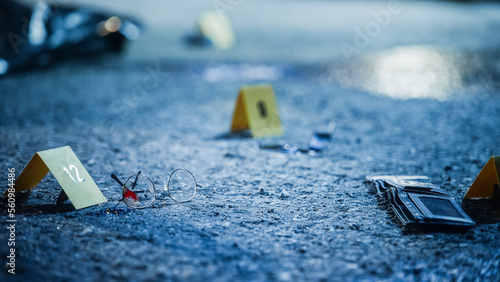 Bloodied Glasses, Bloody Knife and Empty Wallet, all Marked as Clues in a Murder Investigation. Close Up Low Angle Shot of Evidence Scattered at Crime Scene. Forensics Work by Documenting Clues © Gorodenkoff