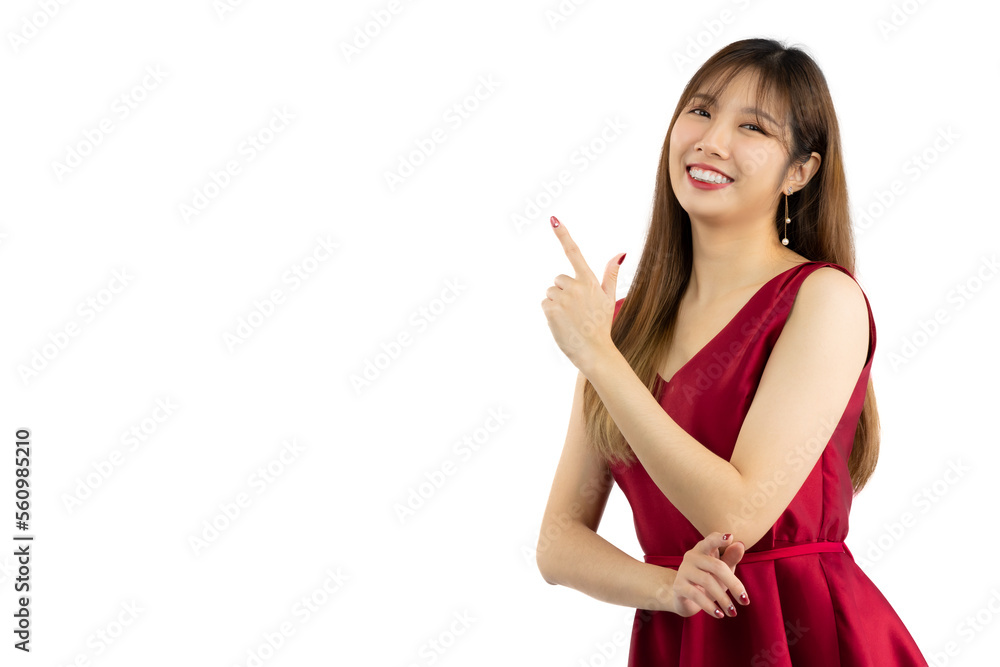 Pretty asian woman long hairstyle wear red elegant dress posed smiling and finger pointing white background. Valentines Concept. Pretty asian woman long hairstyle wear red elegant dress posed smiling and finger pointing white background. Valentines Concept.