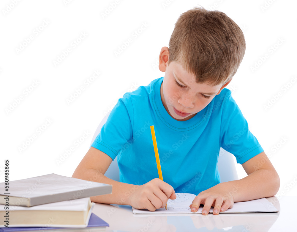 Young boy, writing and learning homework at desk for school, education and student knowledge. Paper, working and child with books for study, creative drawing or academic preschool practice in studio Young boy, writing and learning homework at desk for school, education and student knowledge. Paper, working and child with books for study, creative drawing or academic preschool practice in studio
