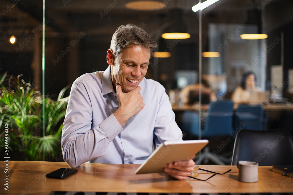 Portrait of businessman in office. Man using digital tablet. Businessman having video call. Portrait of businessman in office. Man using digital tablet. Businessman having video call.