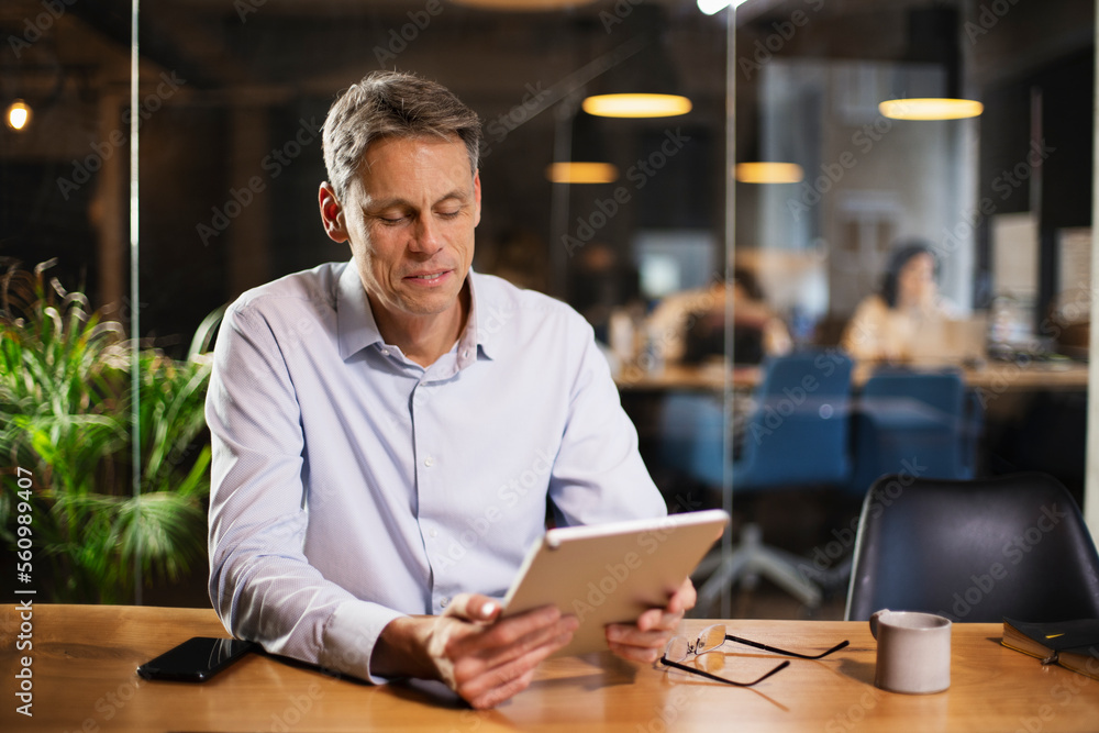 Portrait of businessman in office. Man using digital tablet. Businessman having video call. Portrait of businessman in office. Man using digital tablet. Businessman having video call.