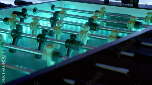 Slow pan of an led-backlit foosball table.  The futuristic setting is perfect for a sci-fi or spaceship setting.  A gorgeous club scene works as well to demonstrate fun ready to be had. photo