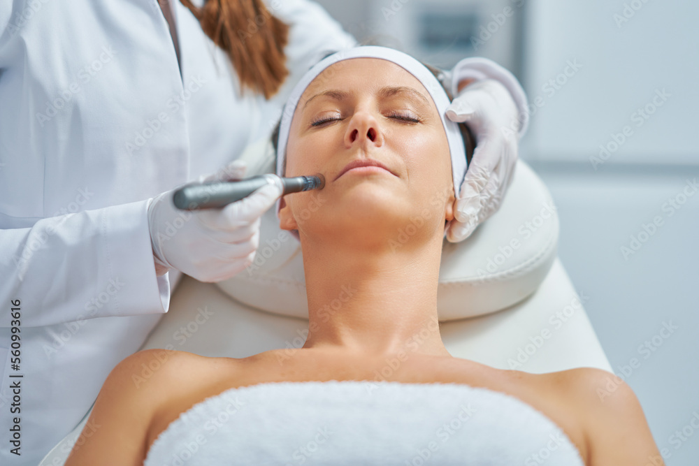 Woman in a beauty salon having needle mesotherapy treatment Woman in a beauty salon having needle mesotherapy treatment