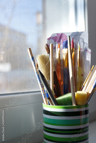 Set of different paint brushes in the glass. Concept of painting