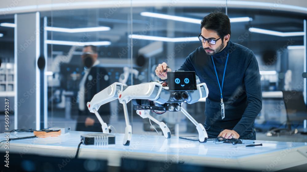 Portrait of Hispanic Engineer Using a Screwdriver While Building and Developing a Robot Dog Concept. Multiethnic Specialist Working in High Tech Research Laboratory with Modern Equipment.