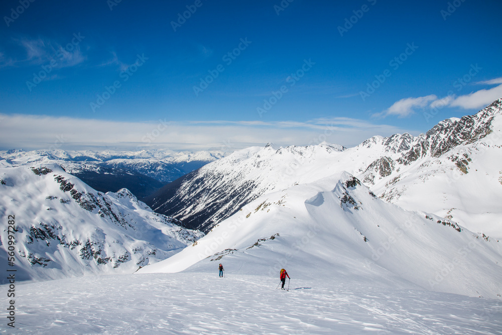 Skiers in a wide open landscape during the Spearhead Traverse in the Coast Mountains of British Columbia, Canada. Skiers in a wide open landscape during the Spearhead Traverse in the Coast Mountains of British Columbia, Canada.