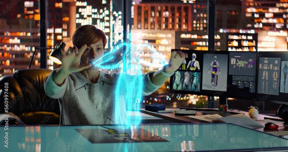 Female Fashion Designer Worke with Holographic Augmented Reality 3D Model. Woman Create New Clothing Collection. Scientific Technology. Fashion and Art Concept Female Fashion Designer Worke with Holographic Augmented Reality 3D Model. Woman Create New Clothing Collection. Scientific Technology. Fashion and Art Concept