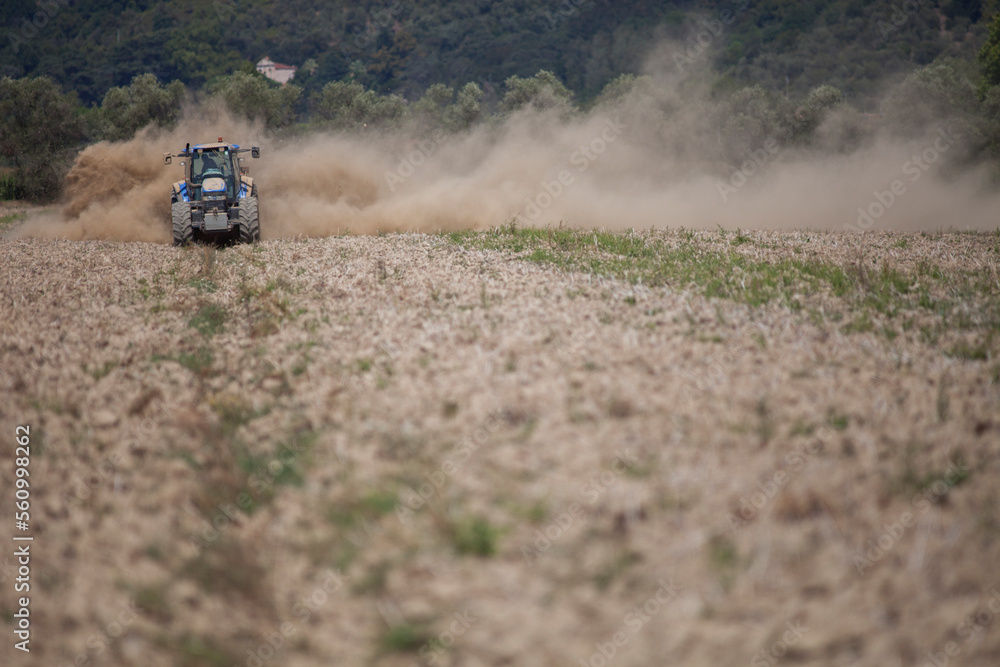 Working the fields with the tractor. Working the fields with the tractor.