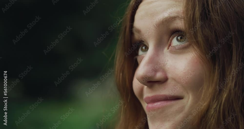 Close up Portrait of a Beautiful Young Redhead Woman Looking Up in a Green Park During Evening Time.Pretty Teenager with Auburn Hair Enjoying Fresh Air in the Park and Taking Care of her Wellbeing Close up Portrait of a Beautiful Young Redhead Woman Looking Up in a Green Park During Evening Time.Pretty Teenager with Auburn Hair Enjoying Fresh Air in the Park and Taking Care of her Wellbeing