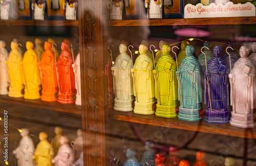 Traditional portuguese showcase with lot of multicolored statues of st. Gonsalo in Amarante city