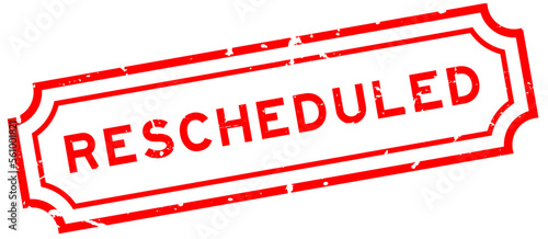 Grunge red rescheduled word rubber seal stamp on white background