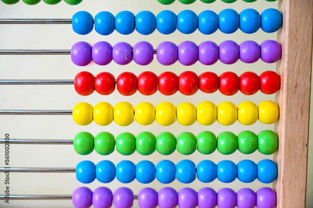 Wooden educational counting toy for children. Abacus counting frame. Calculating tool. Beads on wire. Wooden educational counting toy for children. Abacus counting frame. Calculating tool. Beads on wire.