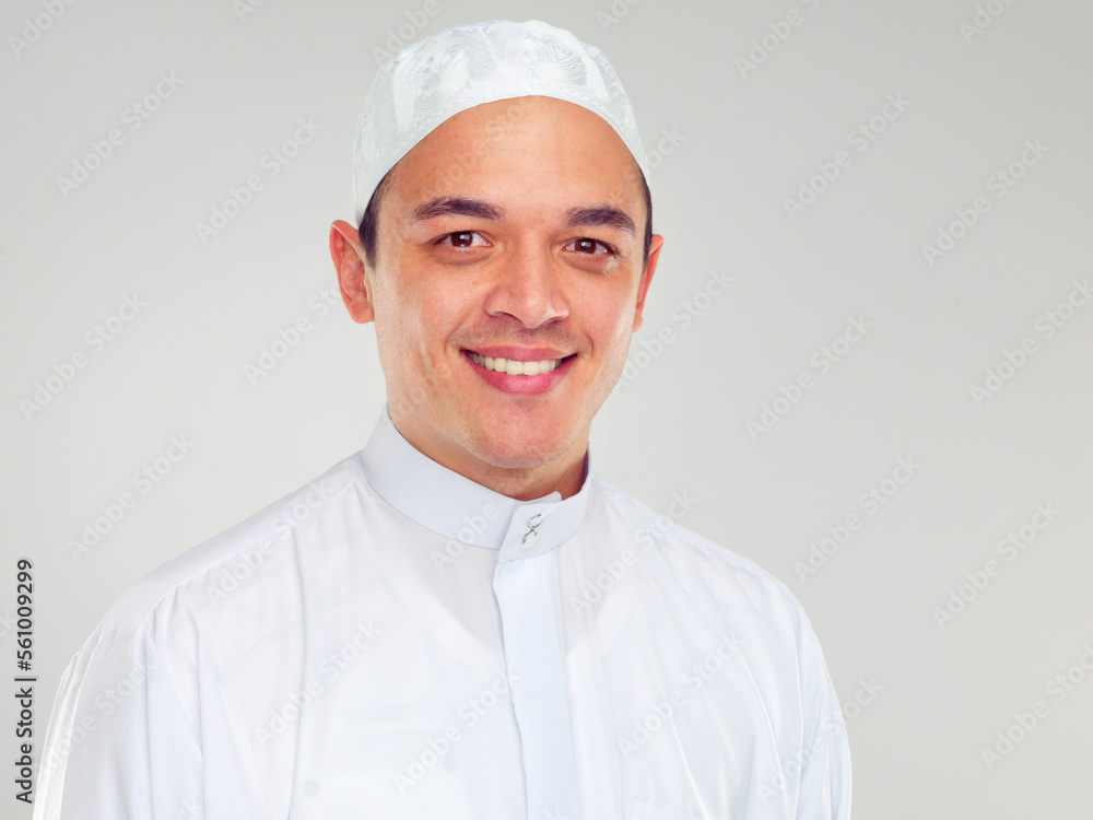 Portrait, muslim and religion with an islamic man in studio on a gray background for faith, belief in god or devotion. Eid, worship and ramadan with a male arab fasting in holy tradition or culture Portrait, muslim and religion with an islamic man in studio on a gray background for faith, belief in god or devotion. Eid, worship and ramadan with a male arab fasting in holy tradition or culture
