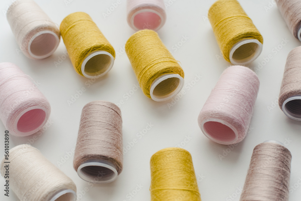 Thread spools. Bobbins with colored threads. Thread spools. Bobbins with colored threads.