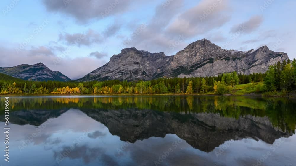 Wedge pond with rocky mountains and pine forest in autumn season at Kananaskis country Wedge pond with rocky mountains and pine forest in autumn season at Kananaskis country