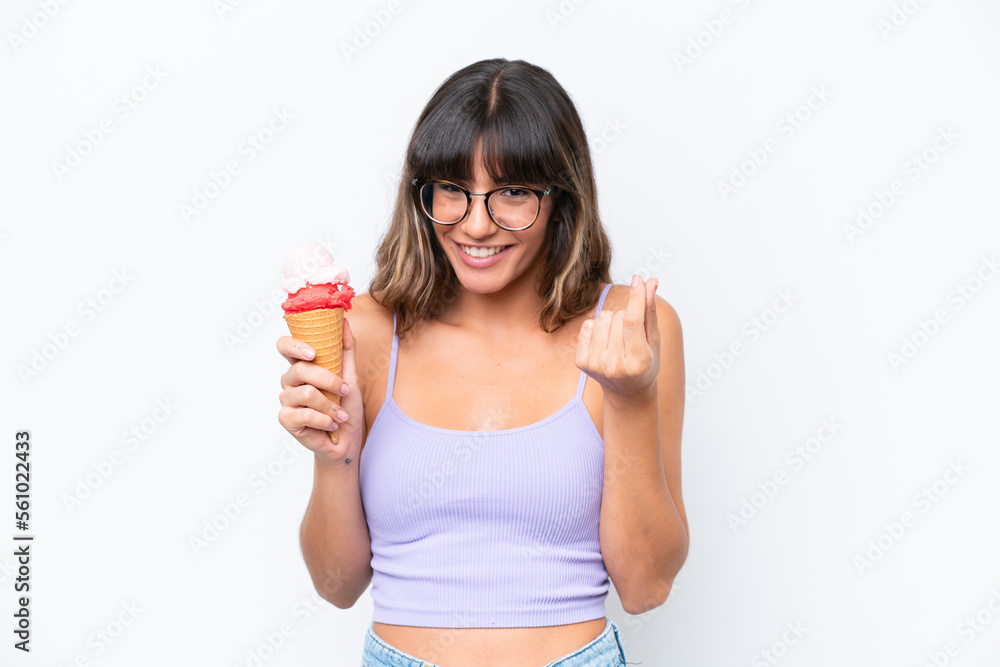 Young caucasian woman with a cornet ice cream over isolated white background making money gesture Young caucasian woman with a cornet ice cream over isolated white background making money gesture