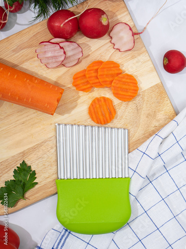 top view of a corrugated knife for cutting vegetables and fruits, original serving of dishes, carving