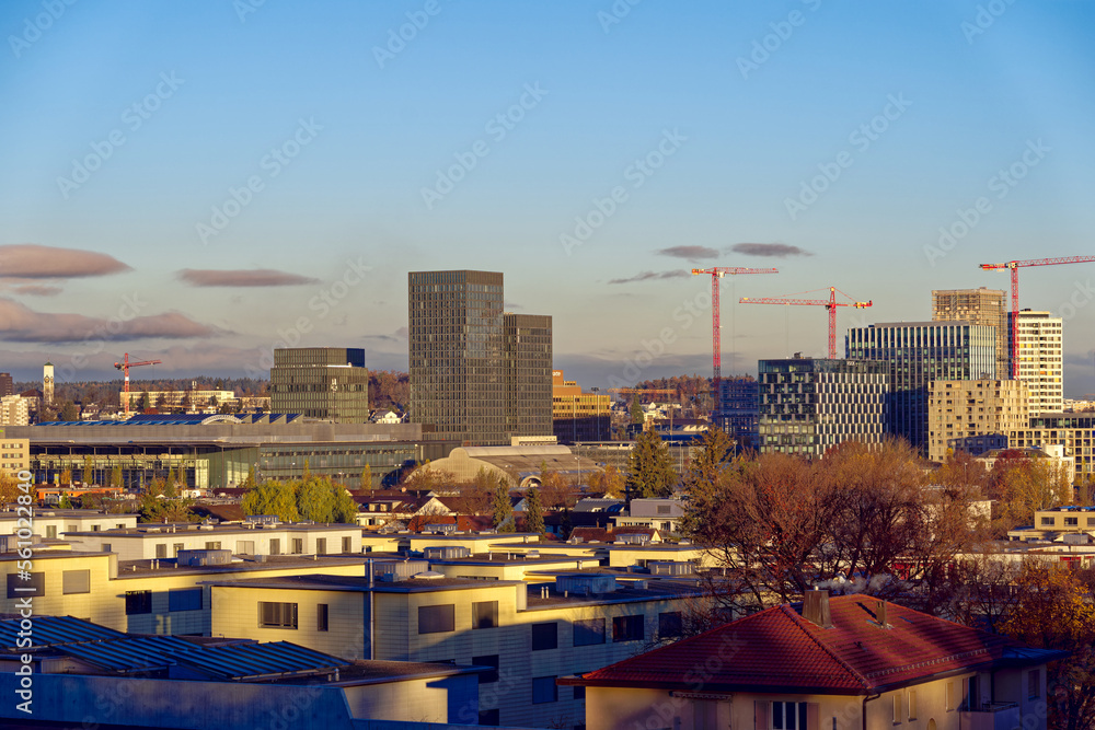 Skyline of City of Zürich North on a sunny autumn morning with skyscrapers and construction sites. Photo taken November 23rd, 2022, Zurich, Switzerland.
