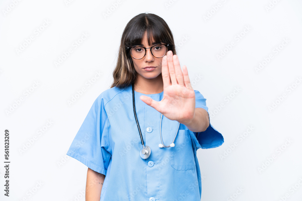 Young caucasian nurse woman isolated on white background making stop gesture Young caucasian nurse woman isolated on white background making stop gesture