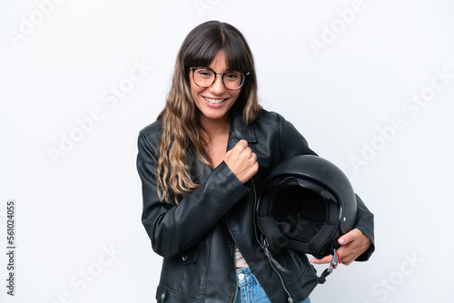 Young caucasian woman with a motorcycle helmet isolated on white background celebrating a victory