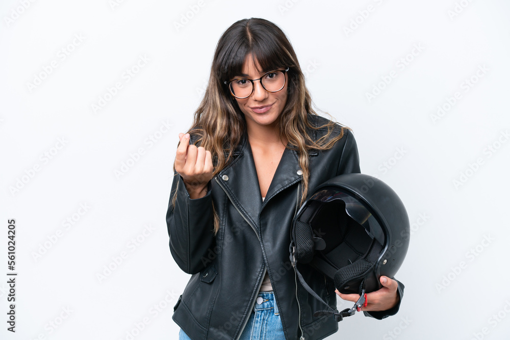 Young caucasian woman with a motorcycle helmet isolated on white background making money gesture Young caucasian woman with a motorcycle helmet isolated on white background making money gesture