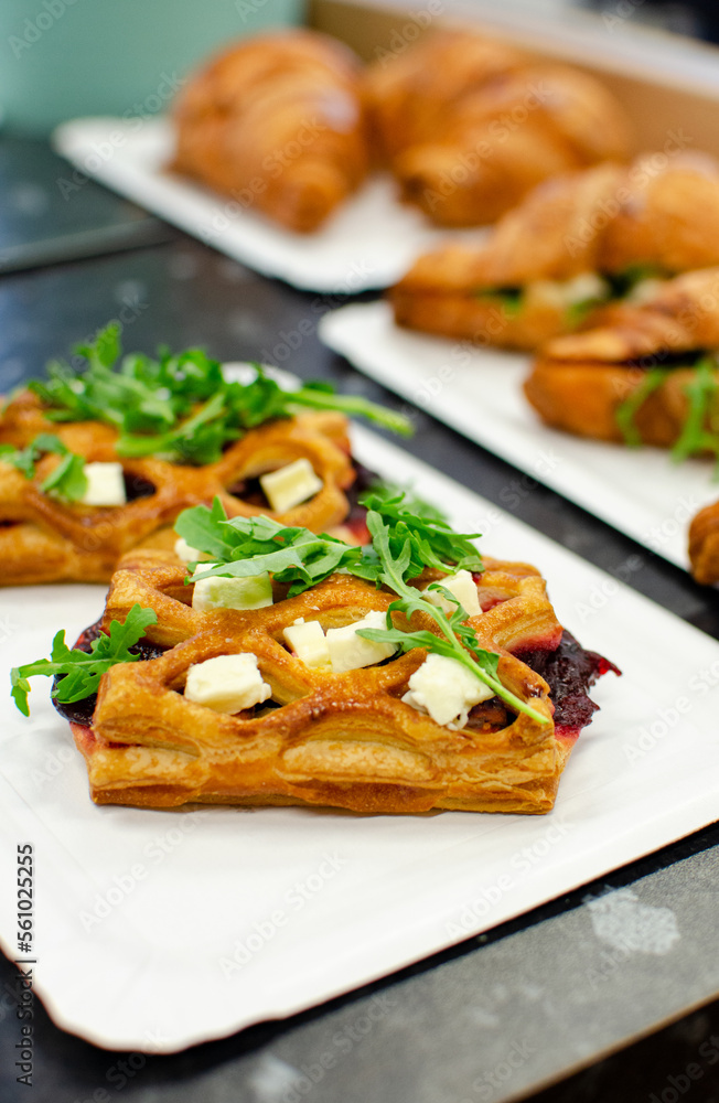Puff pastry with feta cheese and beet on the table 