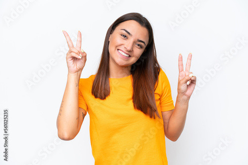 Young caucasian woman isolated on white background showing victory sign with both hands