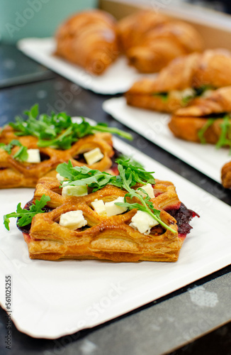 Puff pastry with feta cheese and beet on the table 