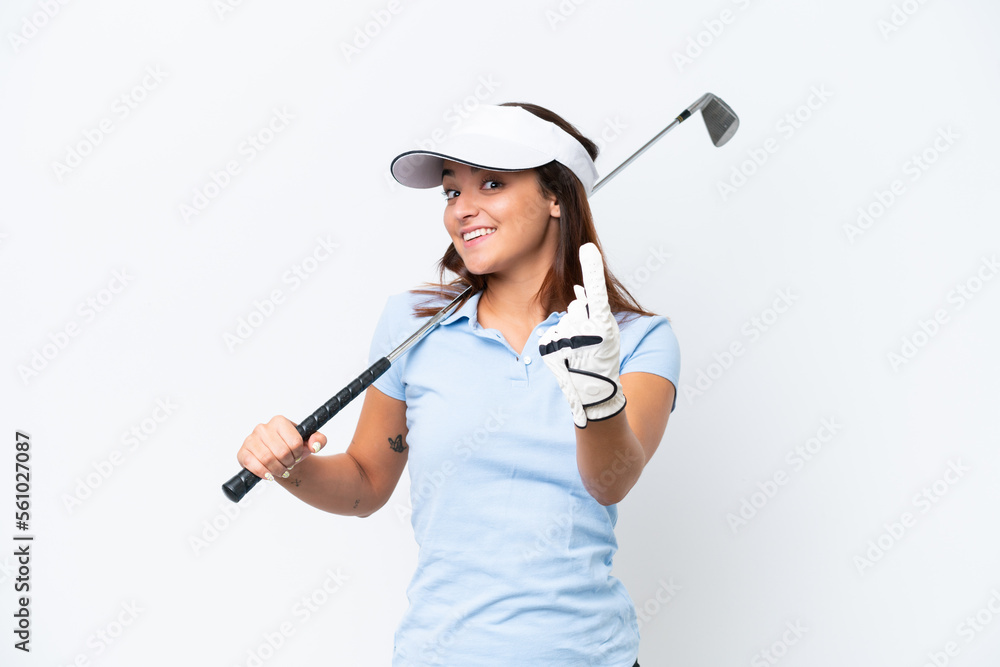 Young caucasian woman playing golf isolated on white background doing coming gesture Young caucasian woman playing golf isolated on white background doing coming gesture