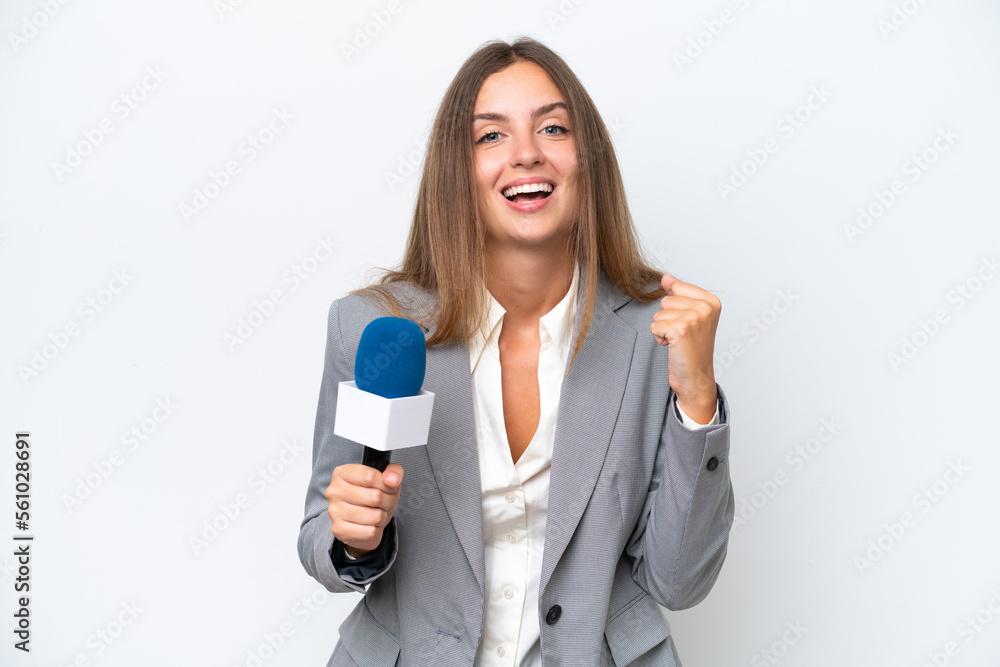 Young TV presenter caucasian woman isolated on white background celebrating a victory in winner position Young TV presenter caucasian woman isolated on white background celebrating a victory in winner position