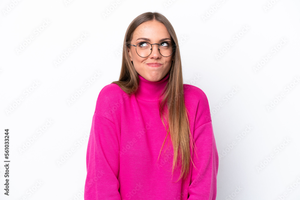 Young caucasian woman isolated on white background having doubts while looking up Young caucasian woman isolated on white background having doubts while looking up