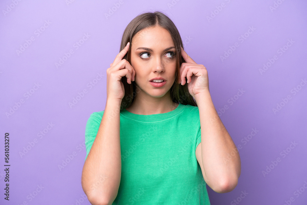 Young caucasian woman isolated on purple background having doubts and thinking Young caucasian woman isolated on purple background having doubts and thinking
