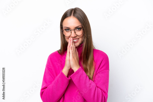 Young caucasian woman isolated on white background keeps palm together. Person asks for something