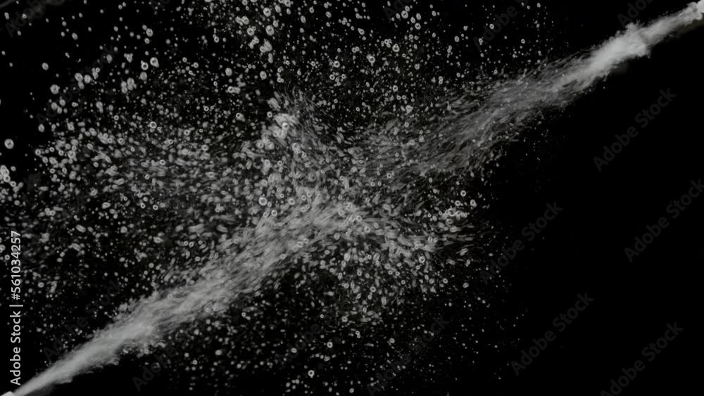 Macro shot of white bubbles are being injected in water from two different corners on black background | Background shot for skin moisturizing cosmetics