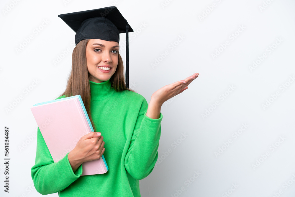 Young student caucasian woman isolated on white background extending hands to the side for inviting to come Young student caucasian woman isolated on white background extending hands to the side for inviting to come